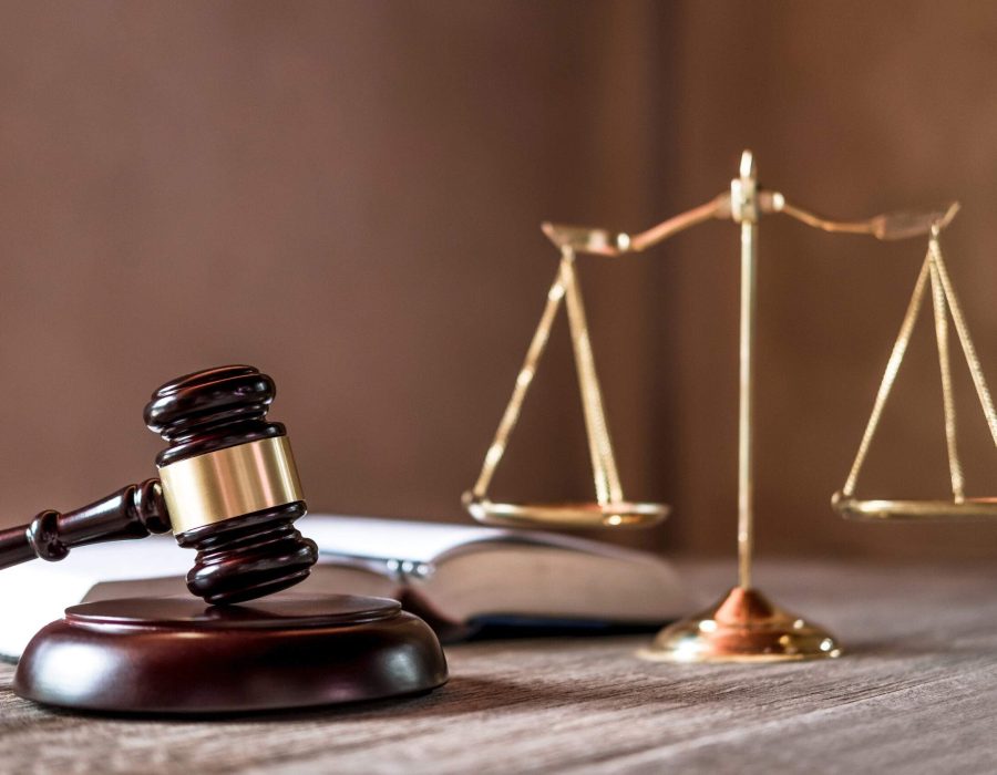 Scales of justice and Gavel on wooden table and agreement in Courtroom, Justice and Law concept.
